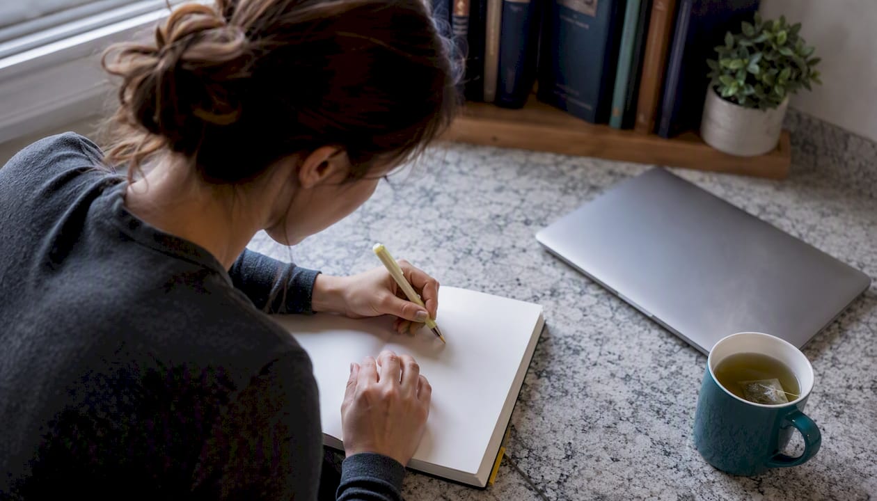 Nursing student actively studying at desk