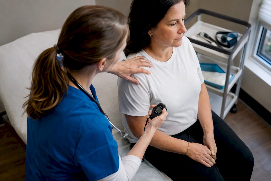 Nurse assessing patient respiratory rate