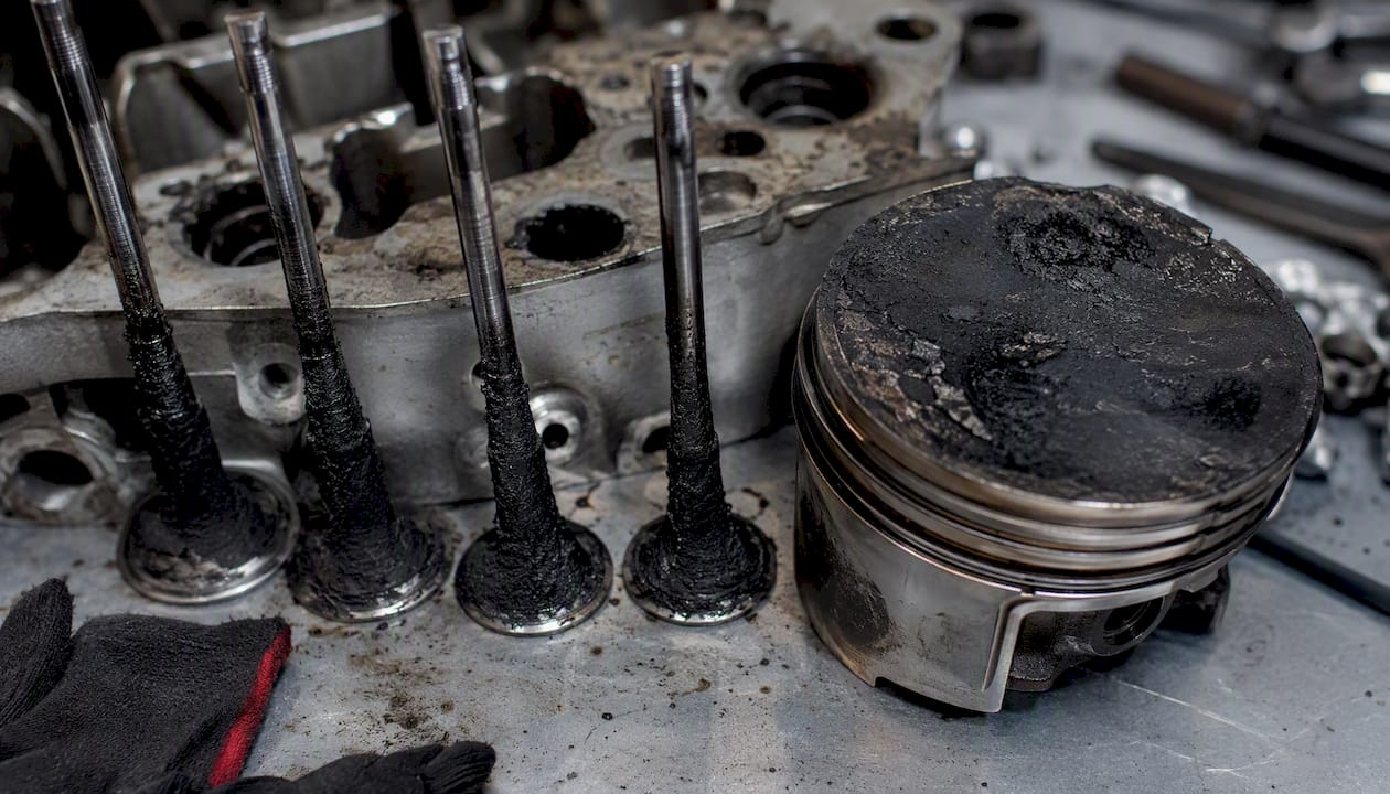 Engine intake valves with visible carbon deposits