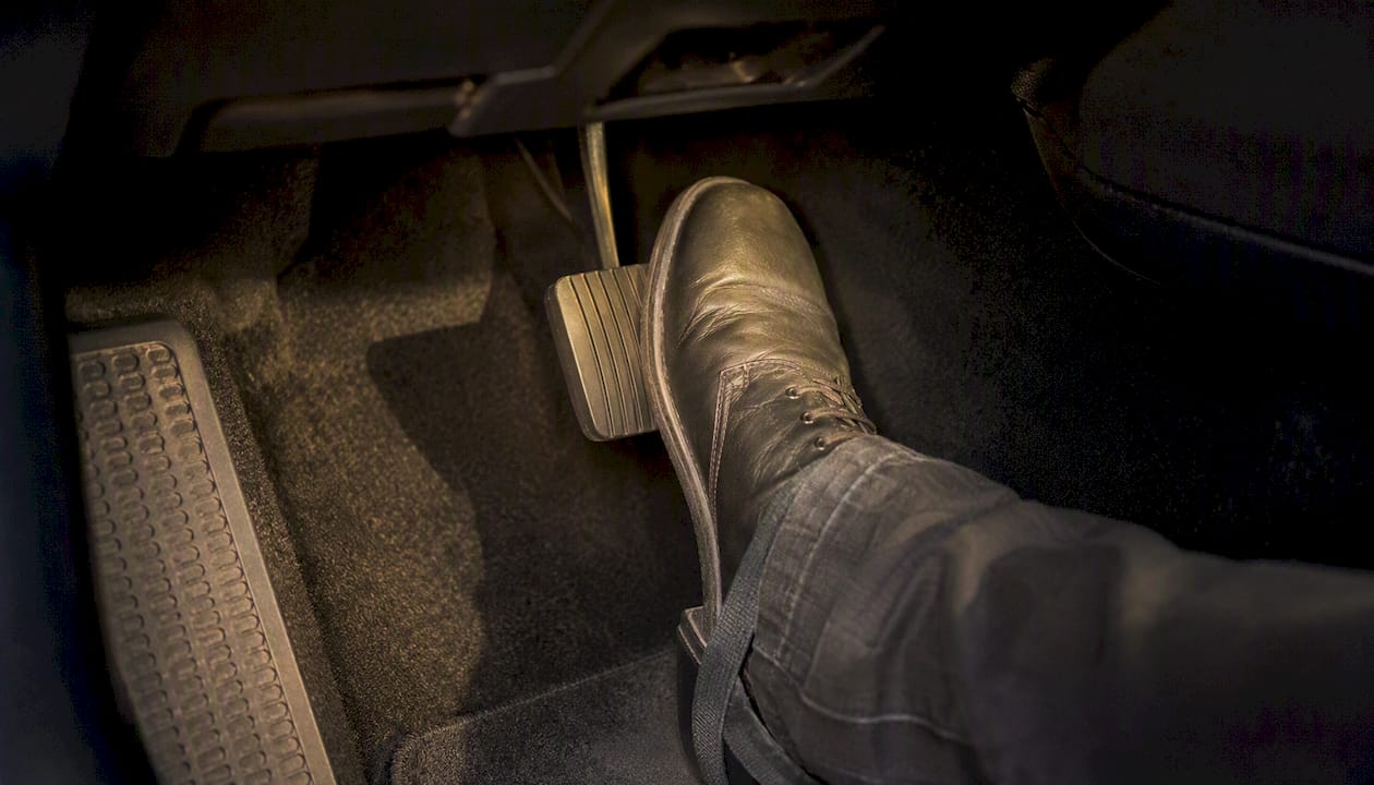 Driver foot pressing accelerator pedal