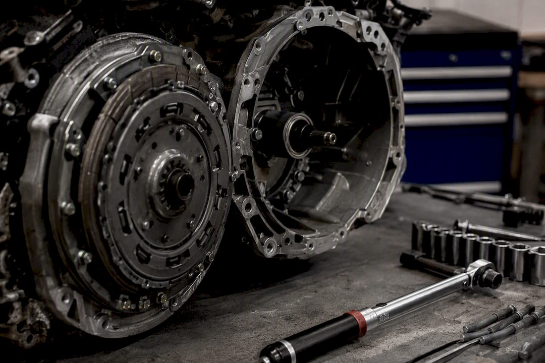 Close-up clutch and gearbox components in workshop