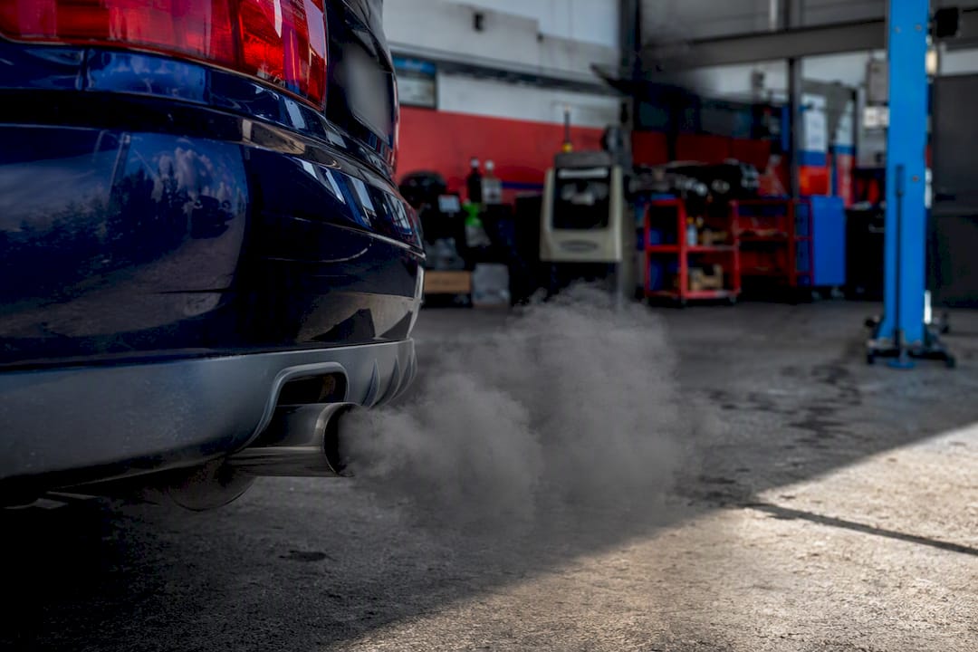 Close-up of diesel exhaust emitting smoke on acceleration