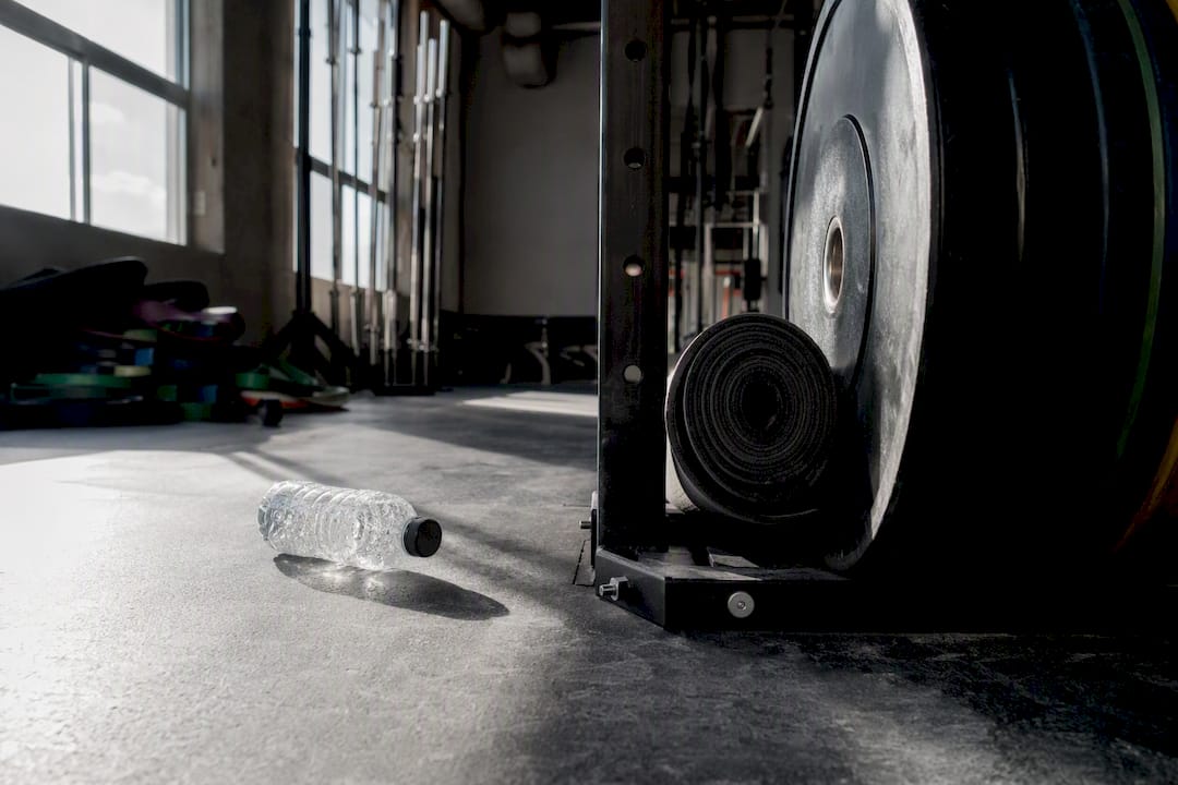 Dumbbell and towel on rack in gym