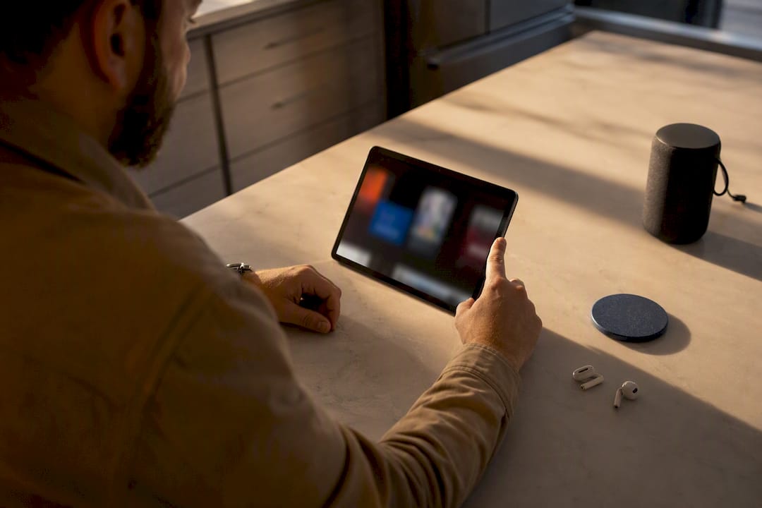 Listener choosing a podcast source at home