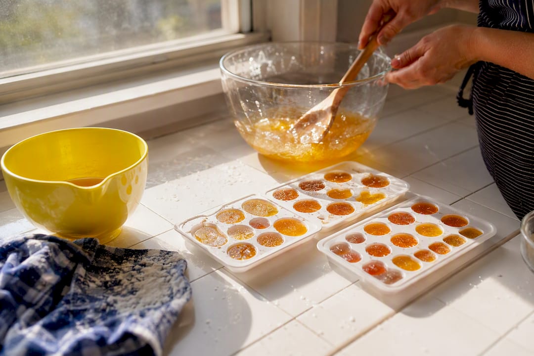 Homemade gummy candy setting in molds