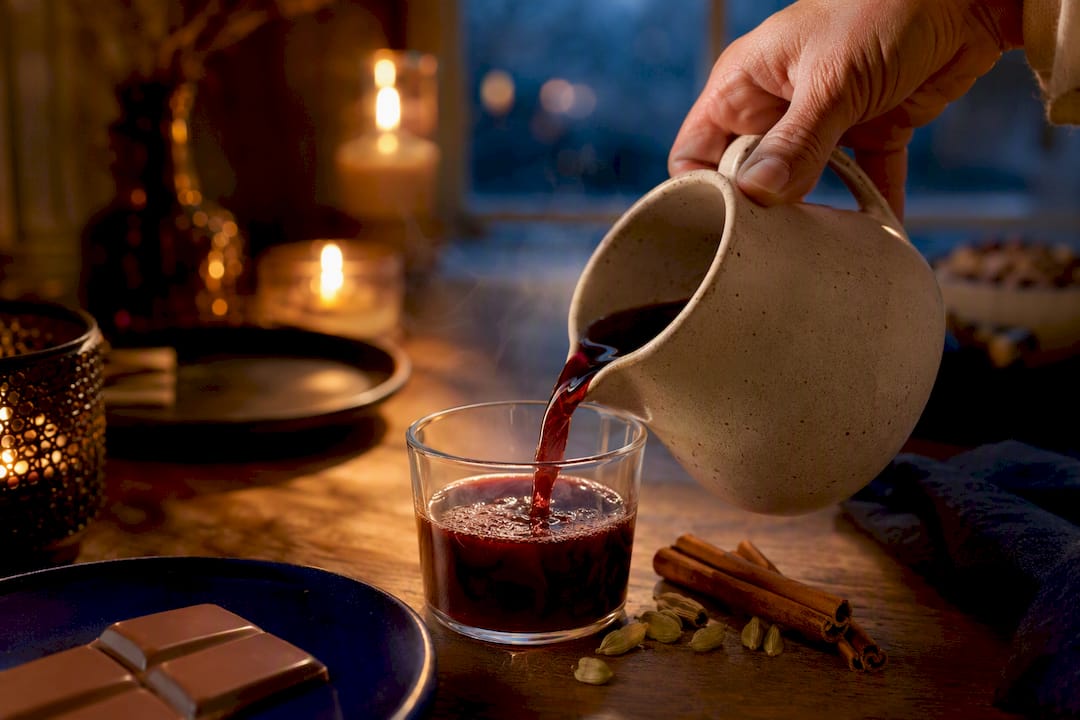 Warm spiced glögg served with chocolate