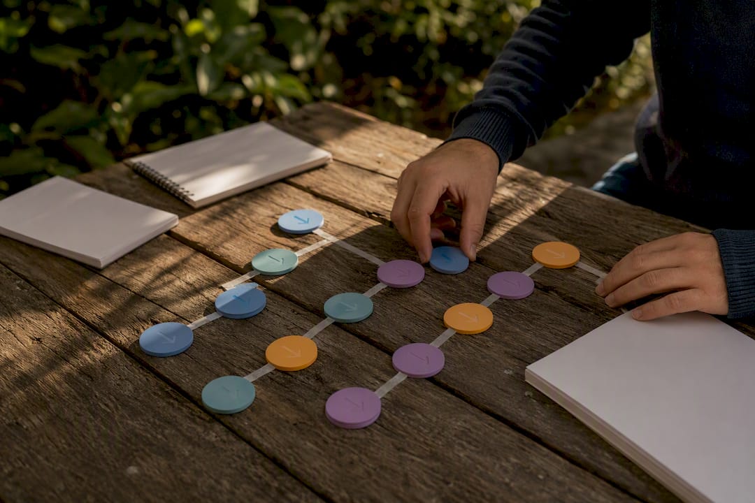 Hands arranging process workflow tokens