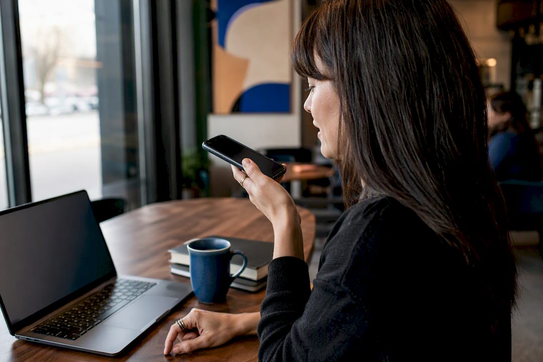 Hands using smartphone voice memo in office
