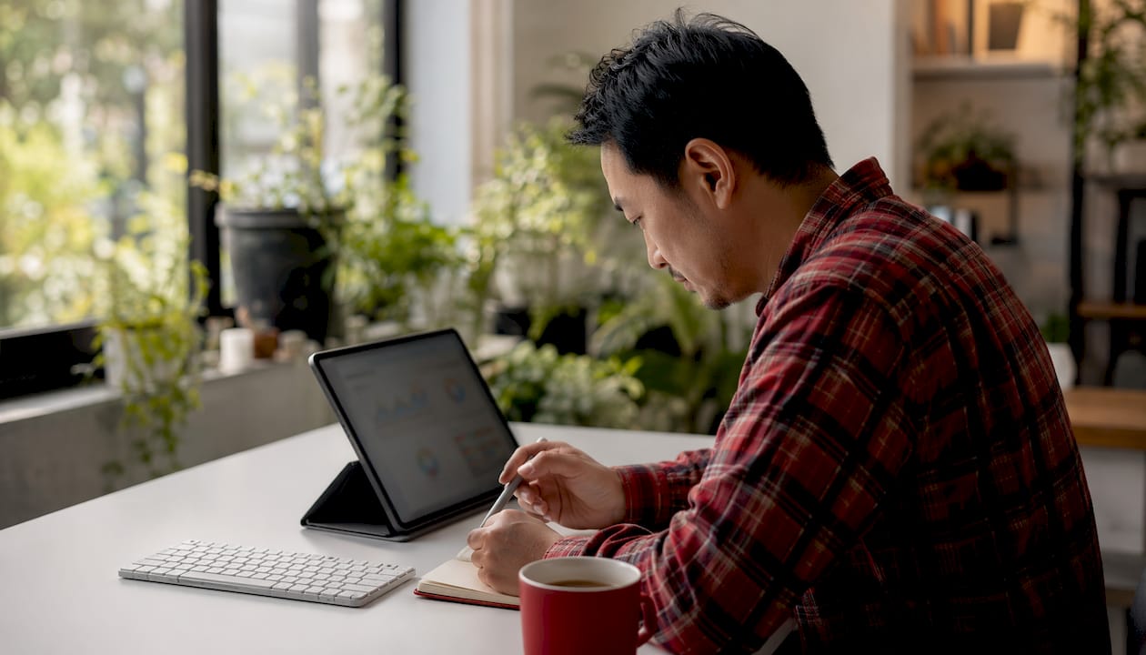 Hands using tablet for predictive analytics on churn