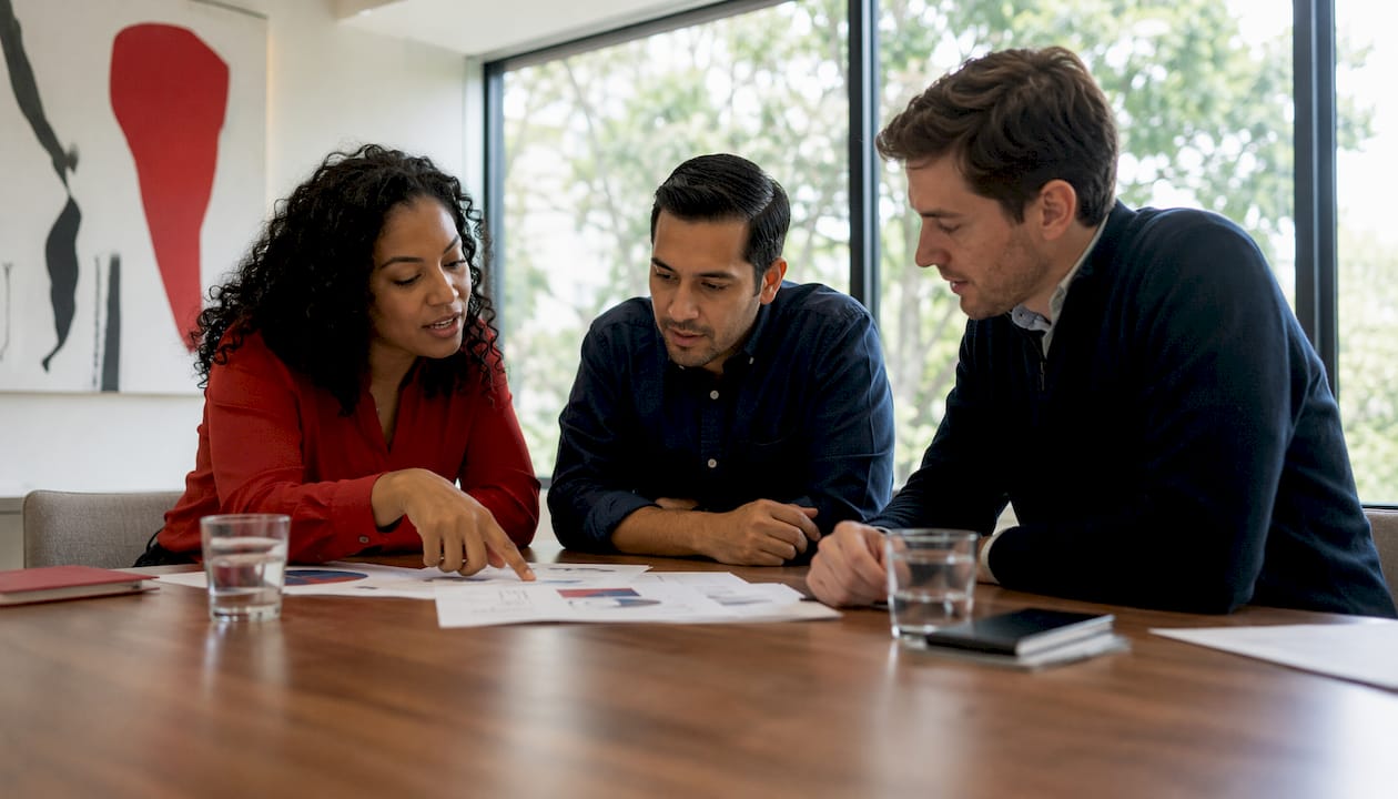 Team discussing forecasting methods in meeting