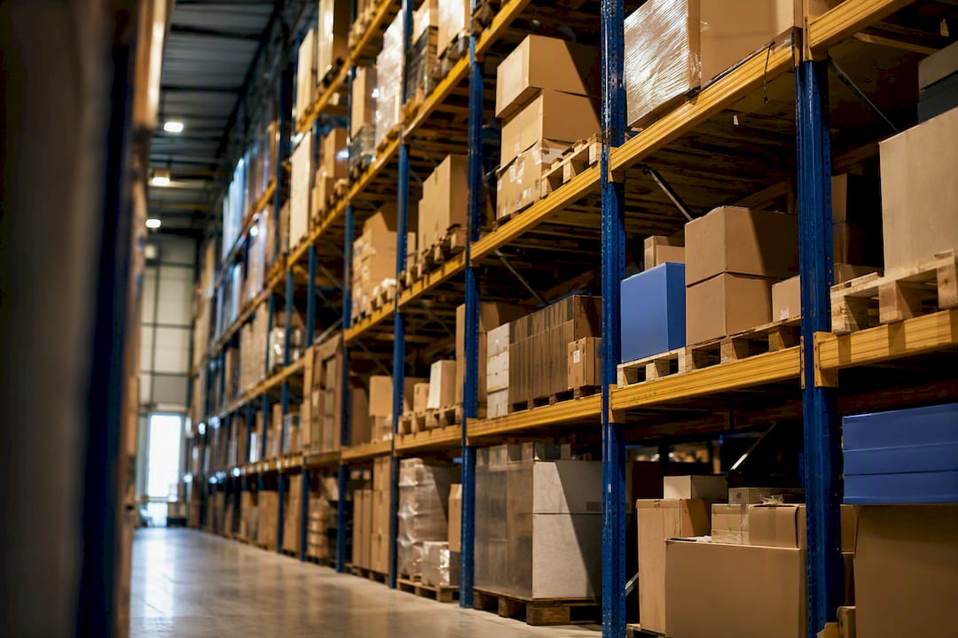 Varied product boxes on warehouse shelves