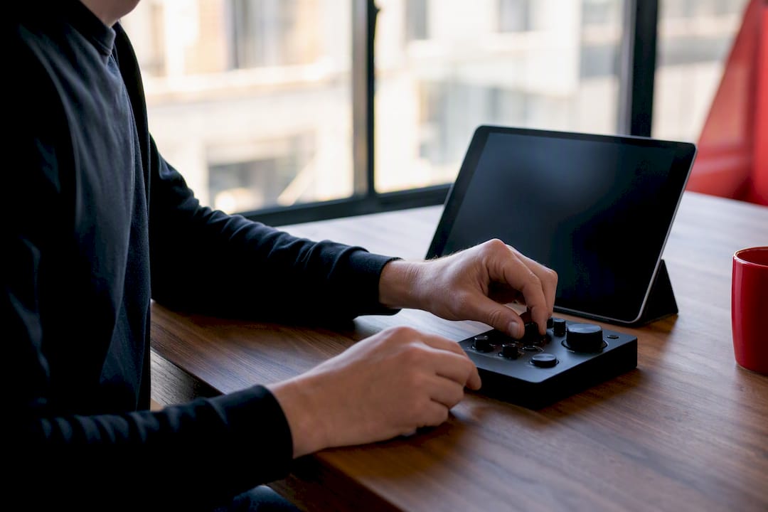 Hands adjusting analytics setup hardware