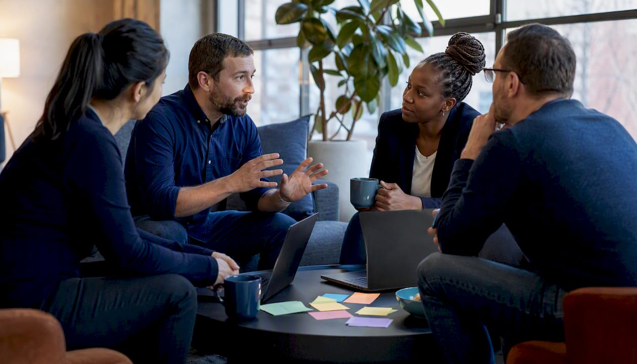Team collaborating on defense-in-depth cybersecurity strategy