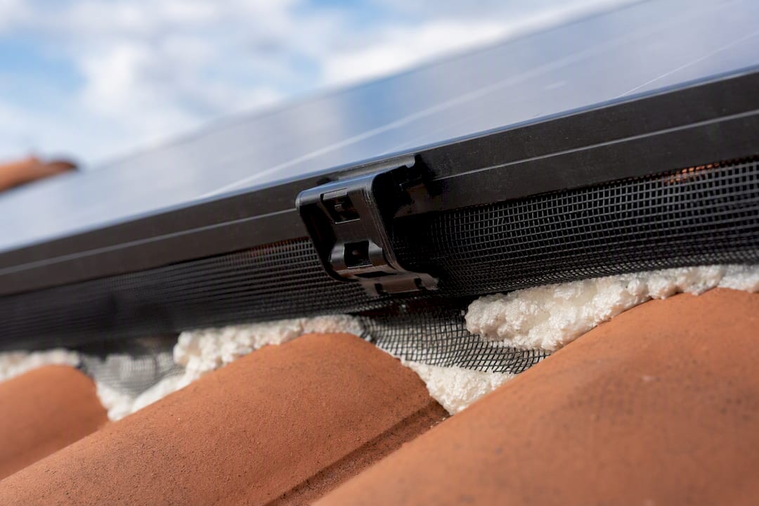 Close-up of solar panel mesh clips and foam filler