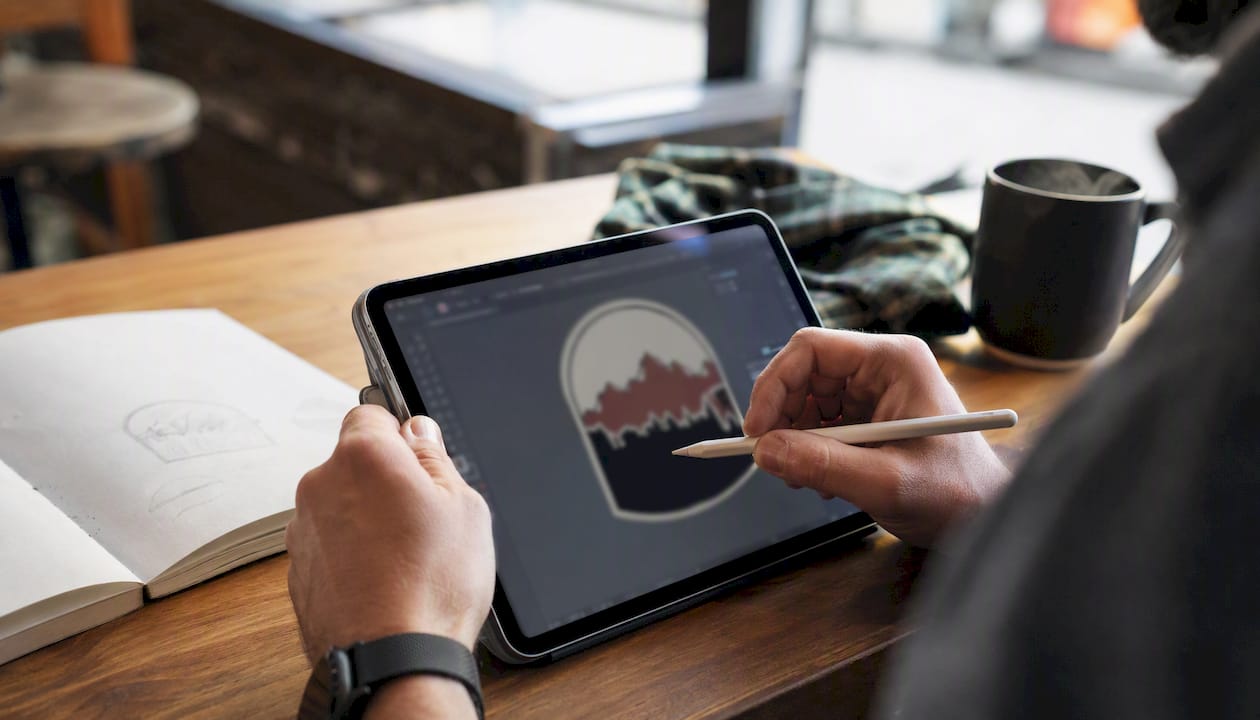 Hands preparing vector patch file on tablet