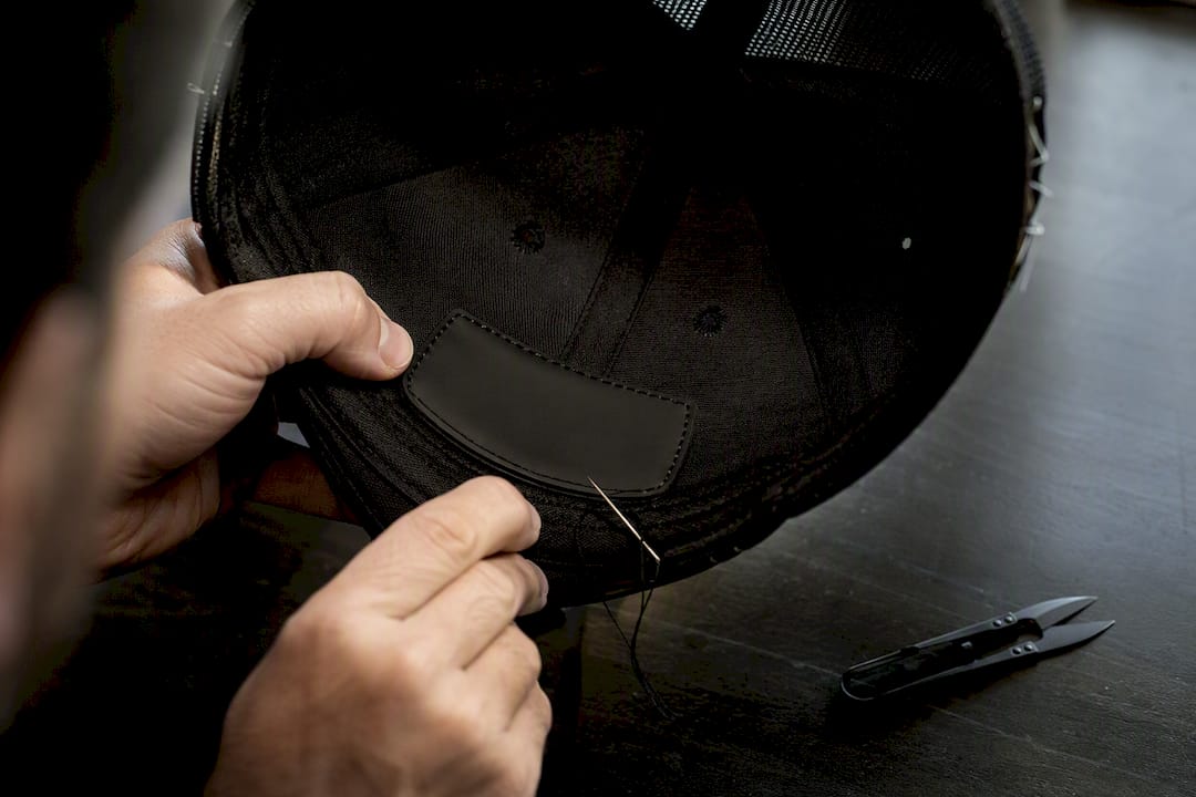 Stitching a PVC patch inside cap crown