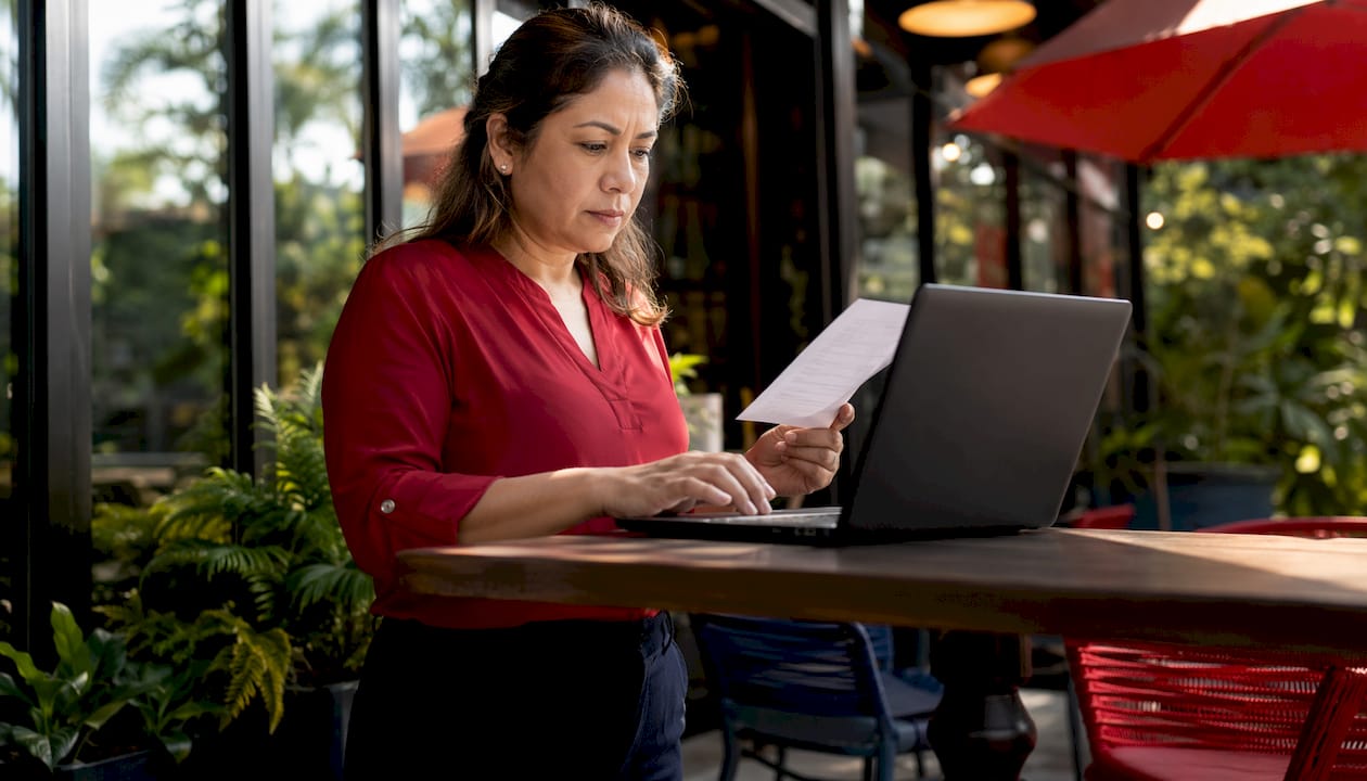 Woman e-filing 1099-MISC at home desk