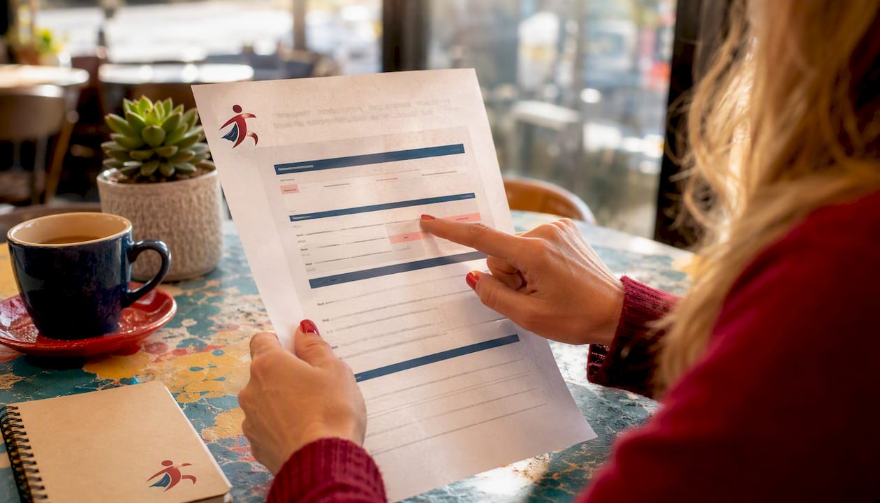Hands holding SSN verification report
