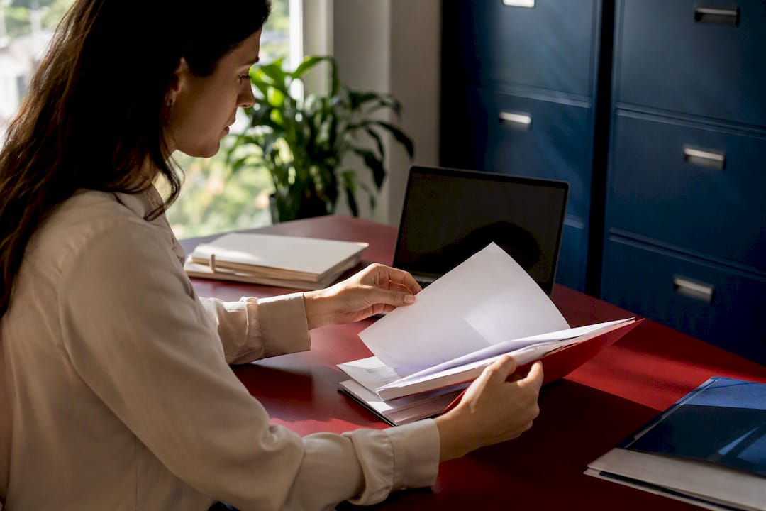 Hands correcting 1099 e-file errors