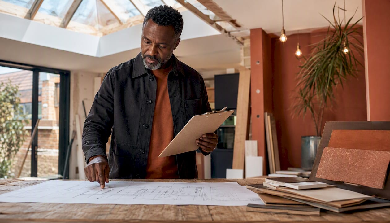 Man assessing home renovation project costs