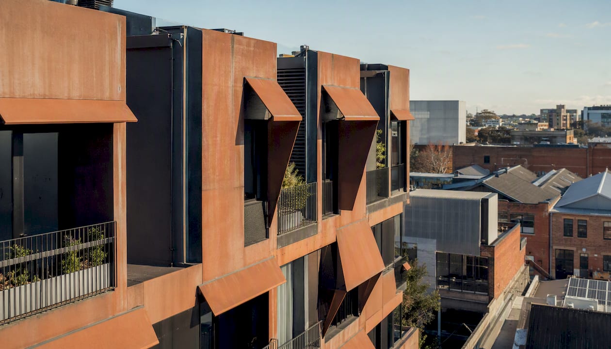 Urban building facade with terracotta window shading
