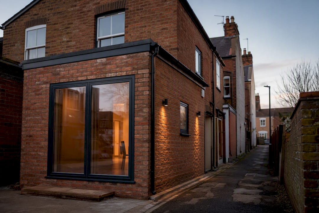 Terraced house extension under overcast sky