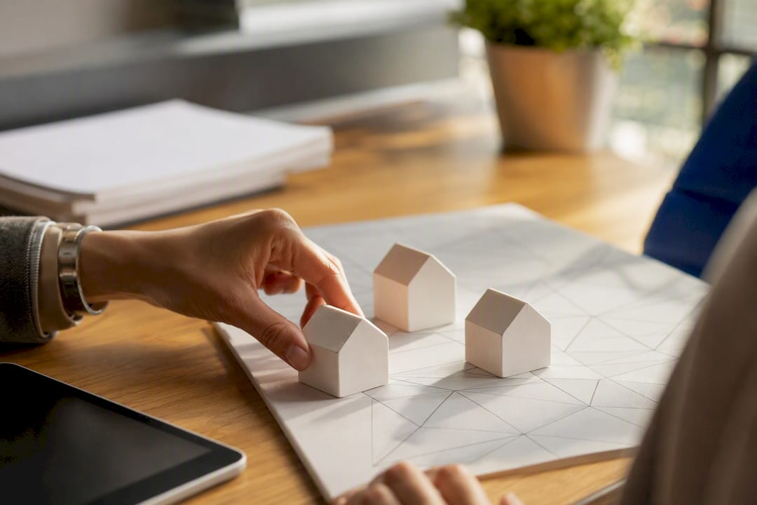 Hands allocating expense tokens on desk