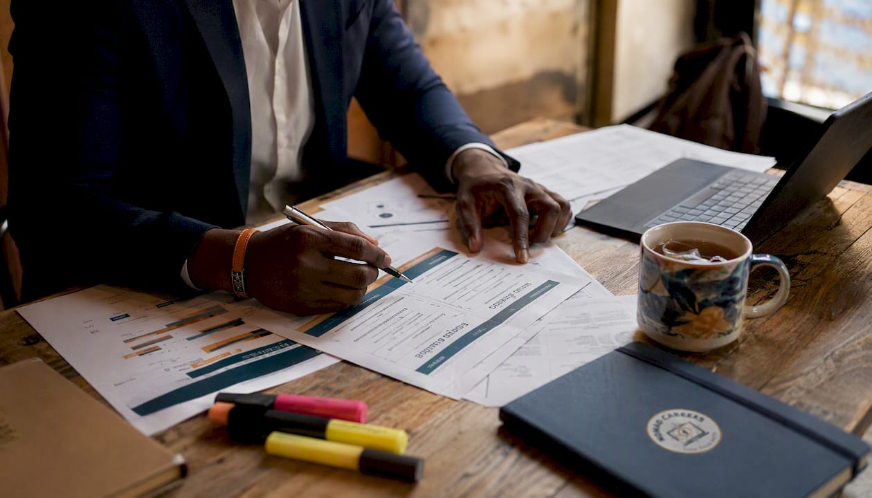 Overhead of hands reviewing hiring model documents
