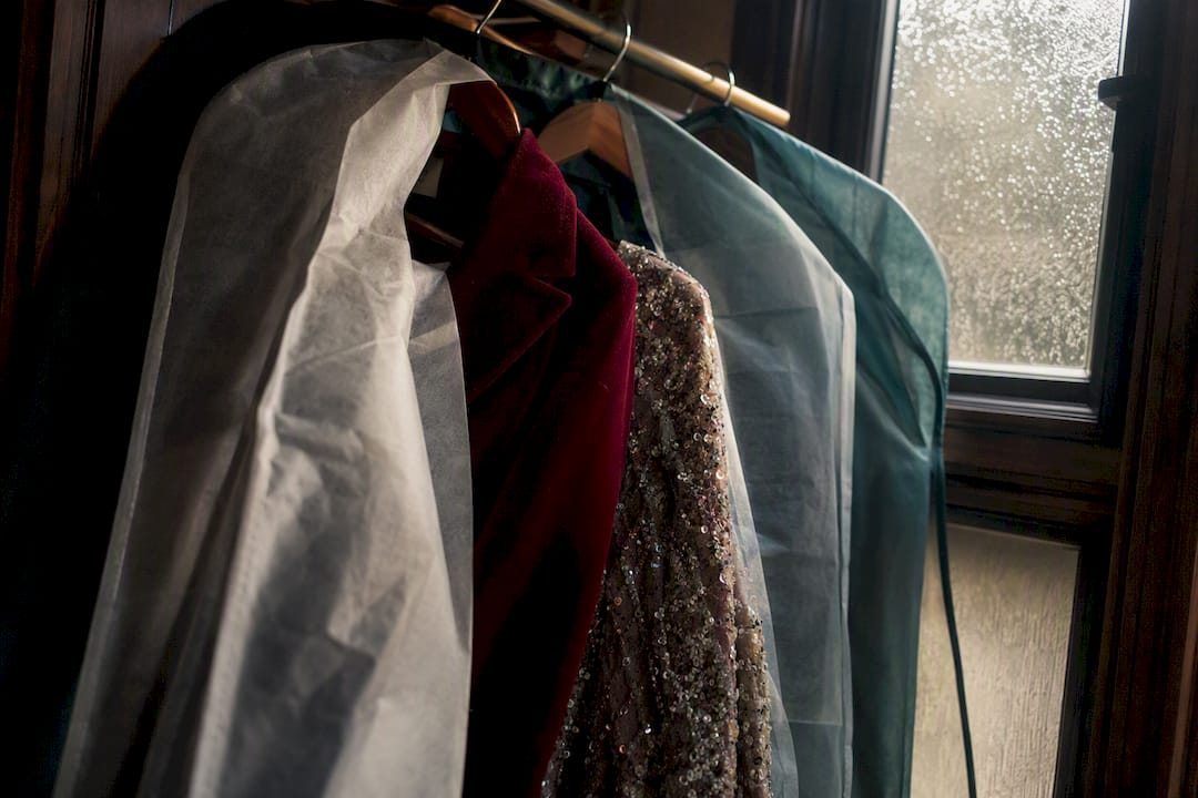 Velvet and sequin garments hanging in closet