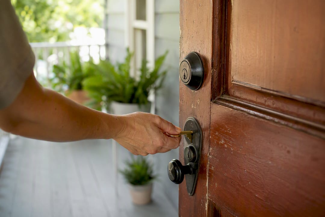Hand unlocking rental property front door
