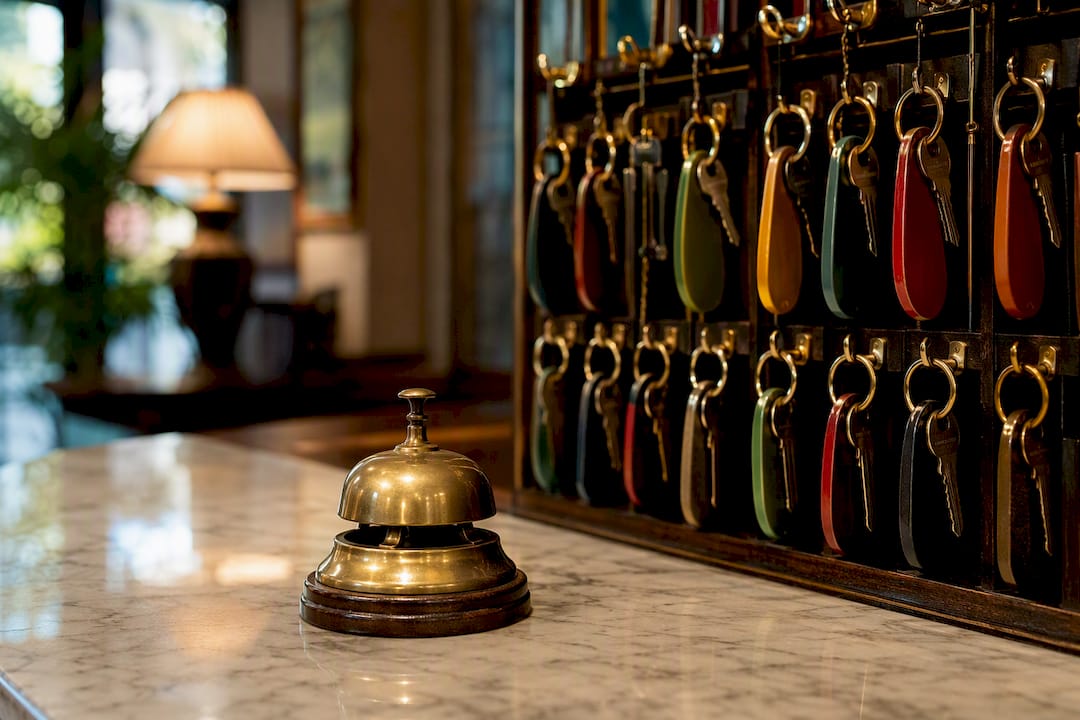 Hotel front desk with keys and bell