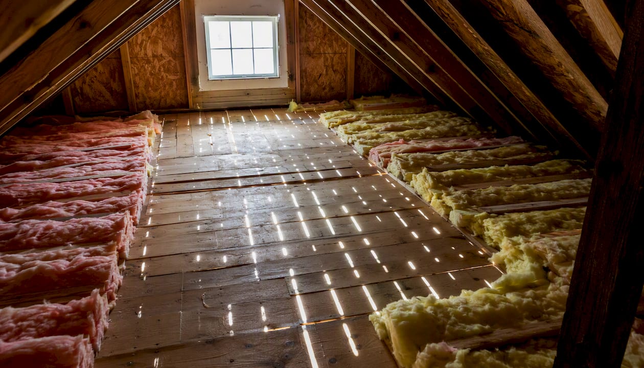 Daylight shining through cracked attic roof boards