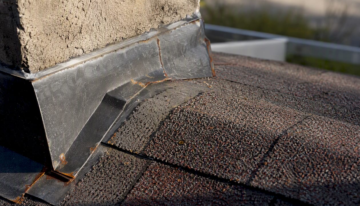 Roof flashing and shingles close-up detail