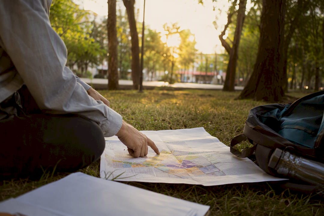 Hands examining zoning map for a fitness studio