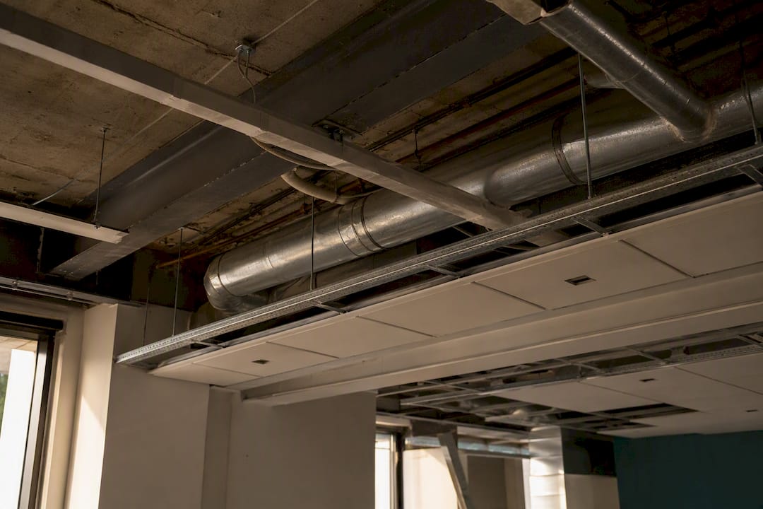 Exposed beams and ducts reducing ceiling height