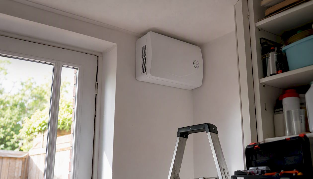 Positive input ventilation unit installed on ceiling