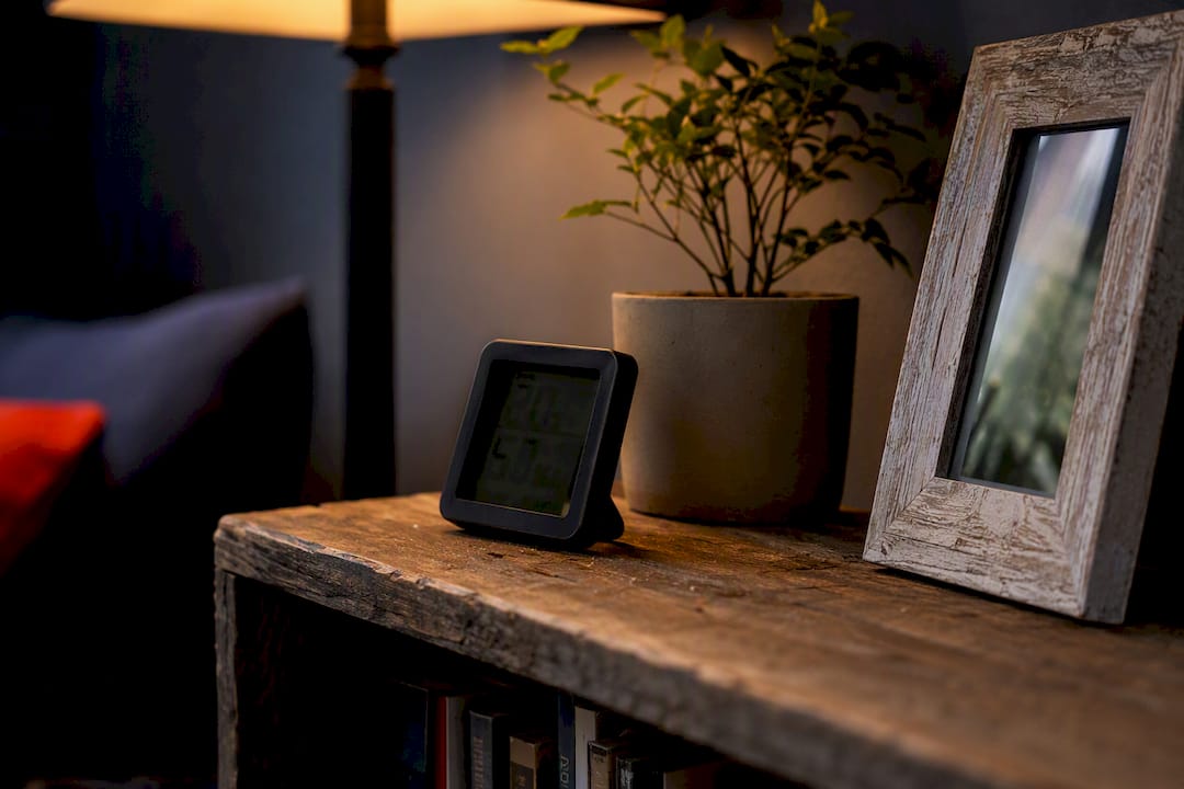Hygrometer on bedside table measuring humidity