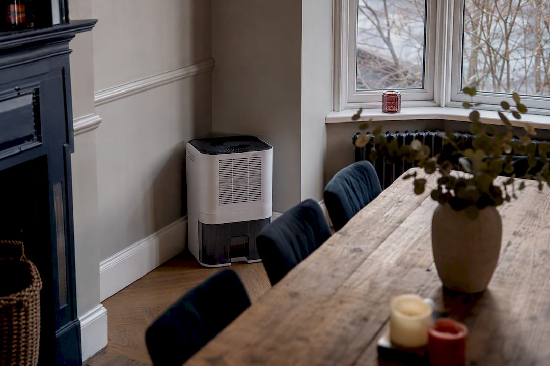 Desiccant dehumidifier in UK home corner