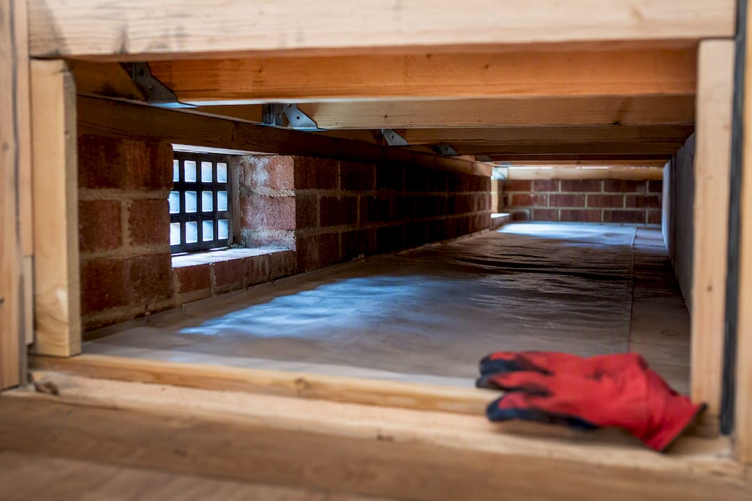 Ventilated suspended floor void beneath timber joists