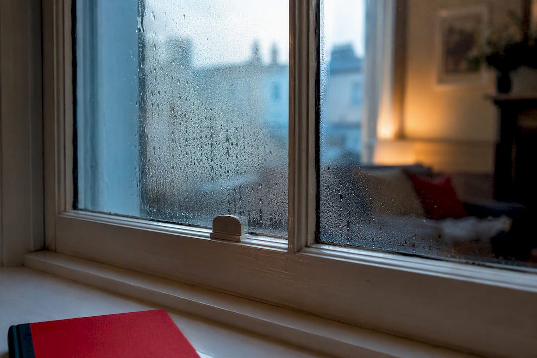 Condensation beads on a period sash window