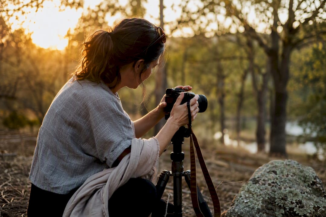 Photographer prepping camera outdoors