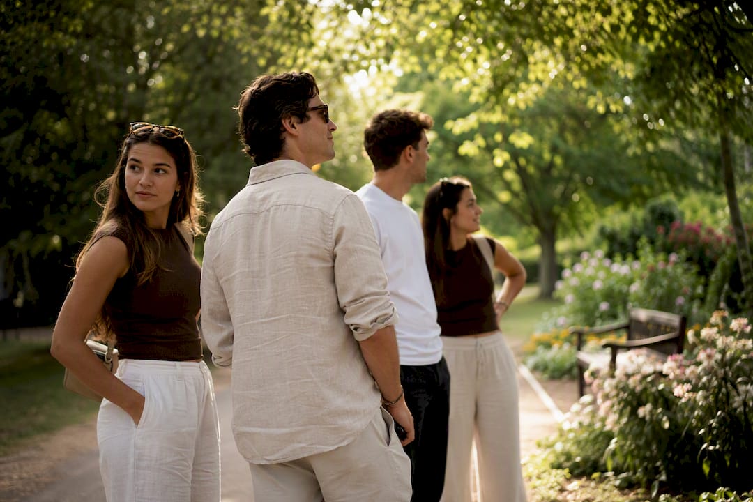 Friends waiting discreetly near proposal spot