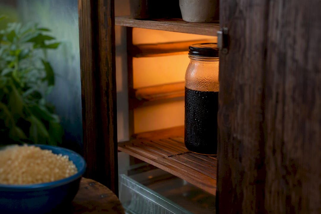 Dark roast cold brew concentrate in fridge jar