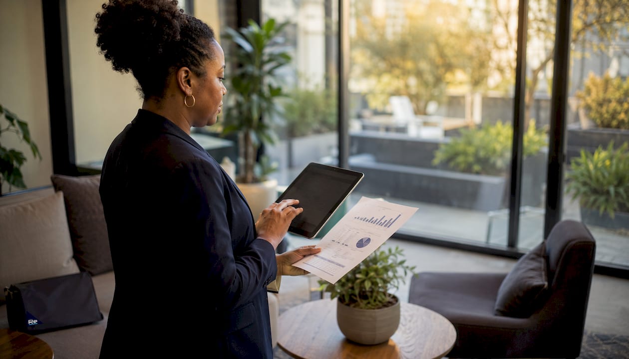 The impact of intelligent building systems in 2026 - Re-solution Hands adjusting energy settings on tablet