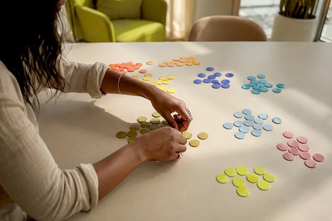 Hands sorting customer match list tokens