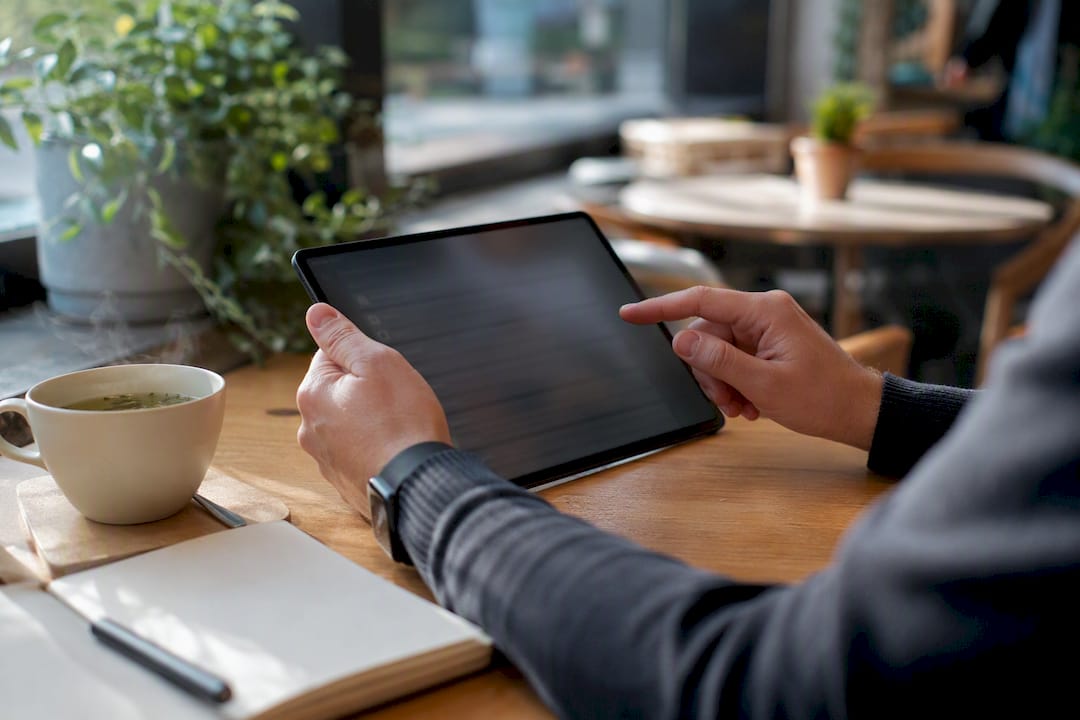 Hands arranging incident response checklist on tablet