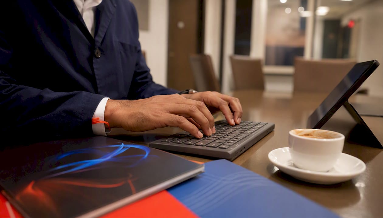 Hands typing in clinical software integration setup