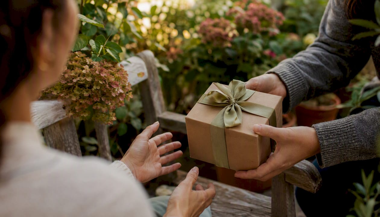 Hands receiving a wrapped gift anxiously