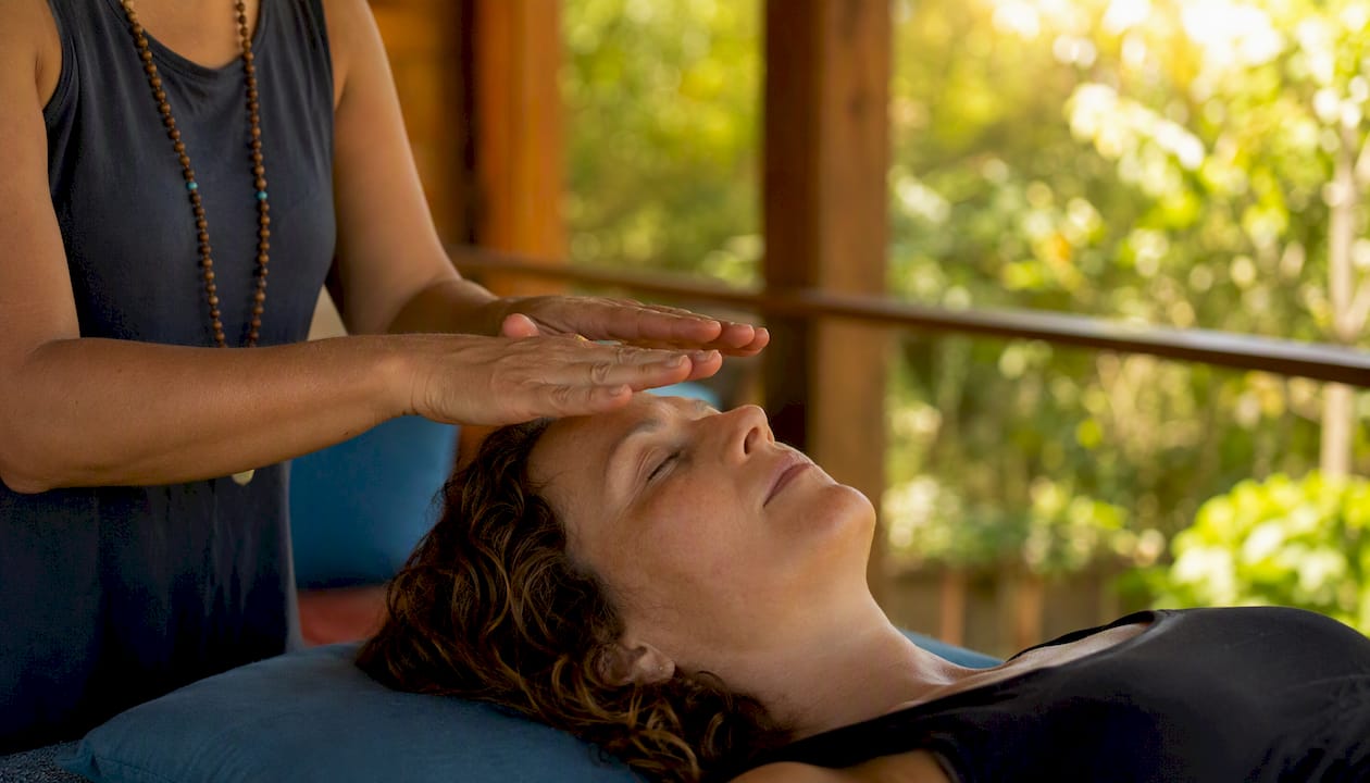 Practitioner’s hands performing guided energy healing