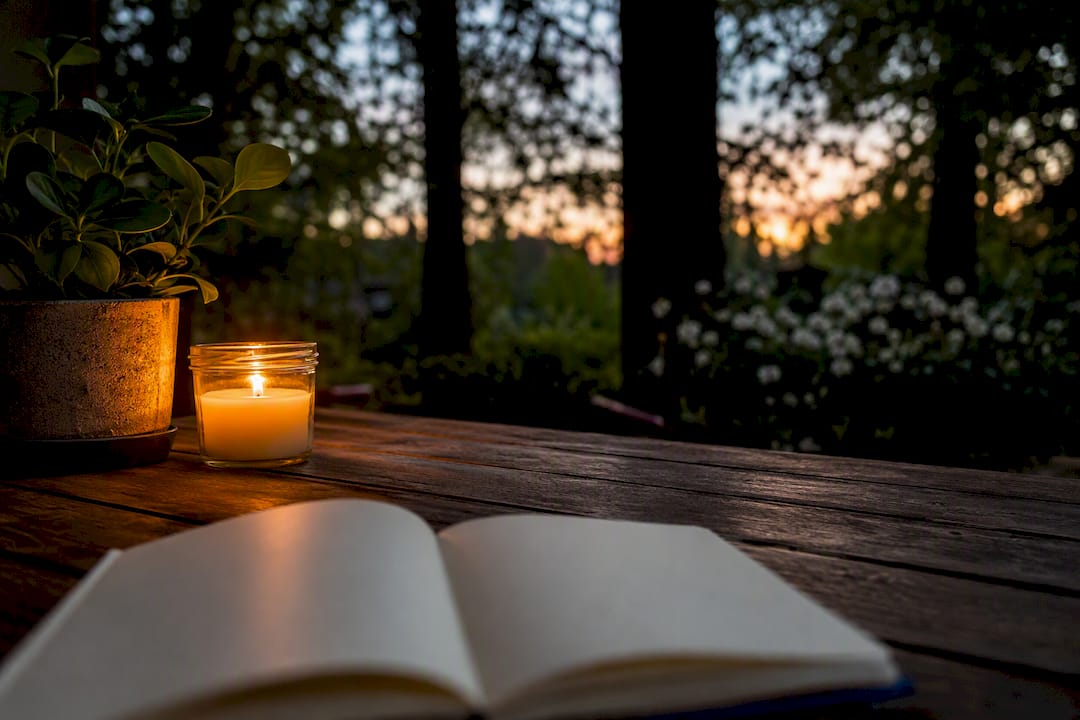 Calm journaling space with candle and plant